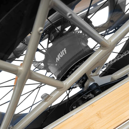 Close-up of a bicycle chain and gear system with 'Nuff' branding.